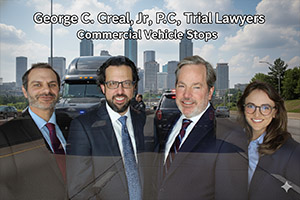 George C. Creal, Jr., P.C. Trial Lawyers team with a commercial truck stop background