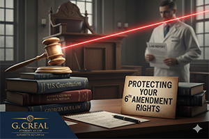Gavel and books in a courtroom with a sign for protecting your 6th Amendment legal rights
