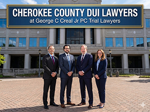 DUI defense attorneys in front of a courthouse; legal representation for DUI in Cherokee County.